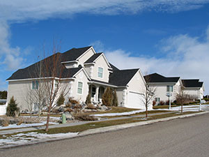 Classy real estate is a hallmark of the Highland hill in Pocatello Beautiful white 2-story house on a hillside street in Pocatello